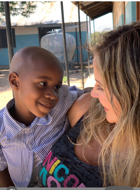 Veronica sharing a warm moment with a student at Zariki School in Tanzania