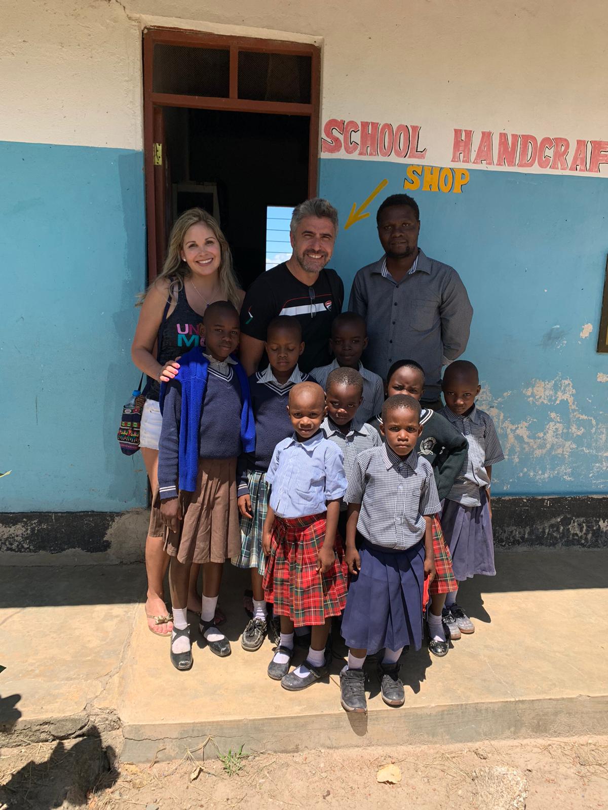 Veronica and Armando with students and staff at Zariki School in Tanzania